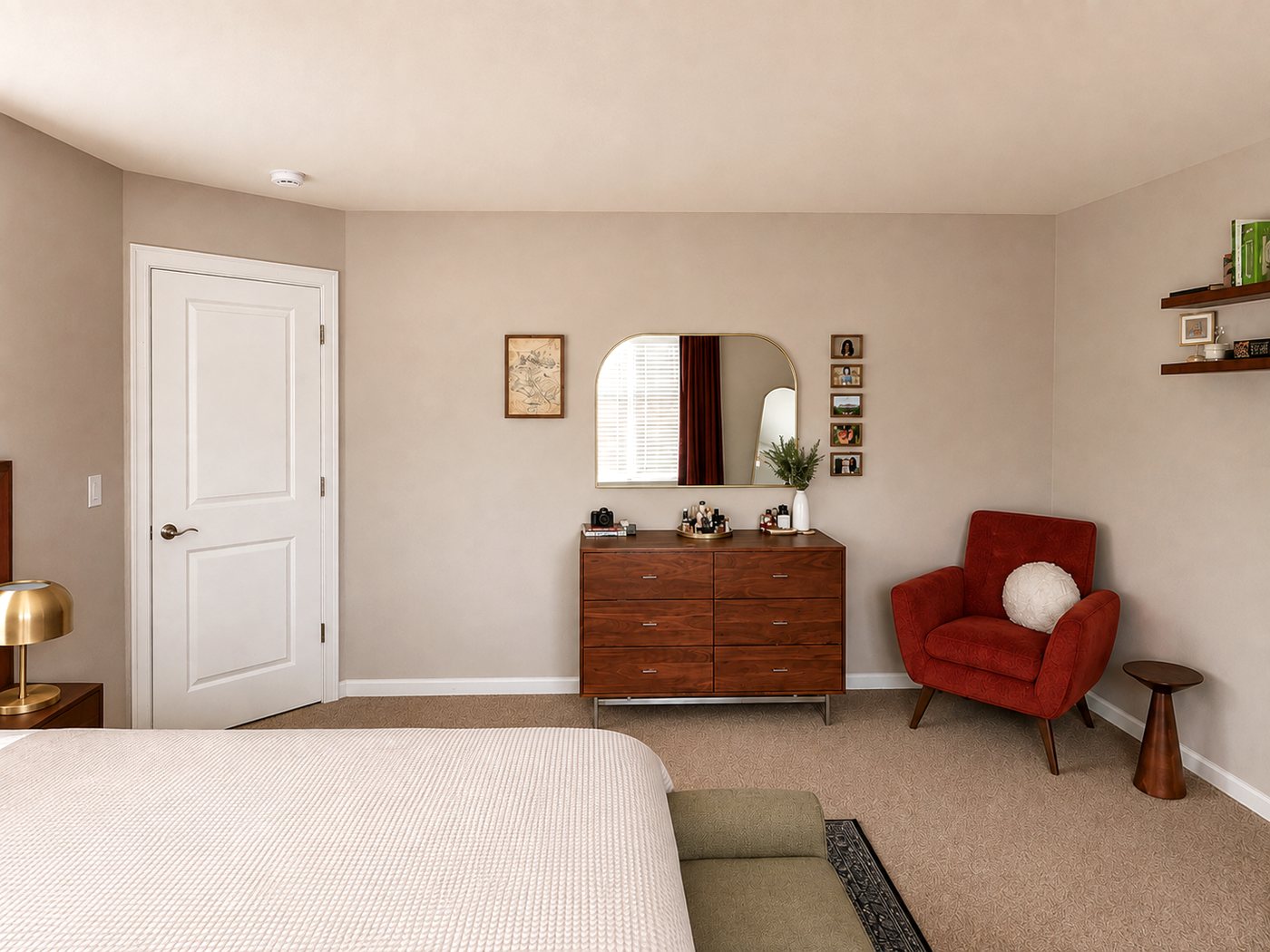 Warm wood dresser, mirror and rust upholstered reading chair