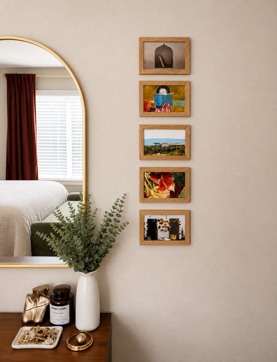 Mirror, personal artwork and styled dresser details