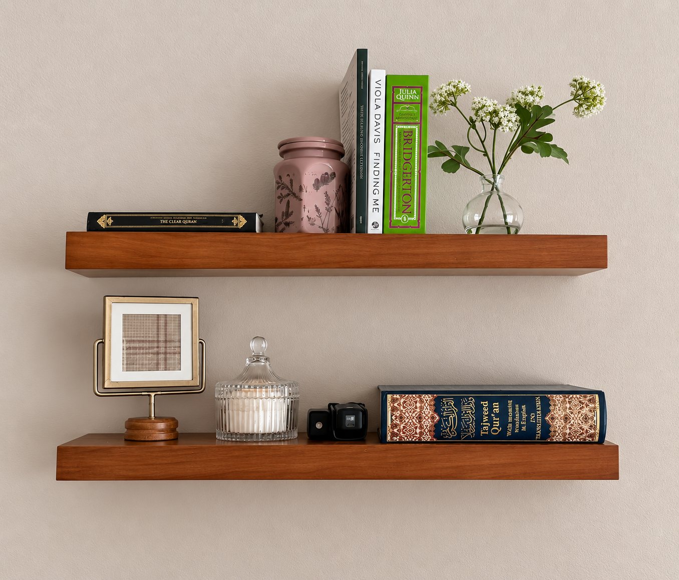 Wood shelves with books, framed photographs and collected objects